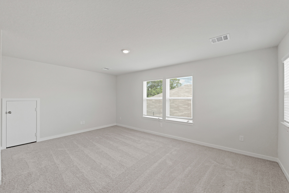 A room with a window and a door.