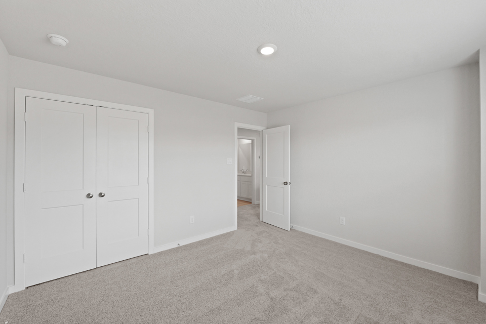 A room with white doors.