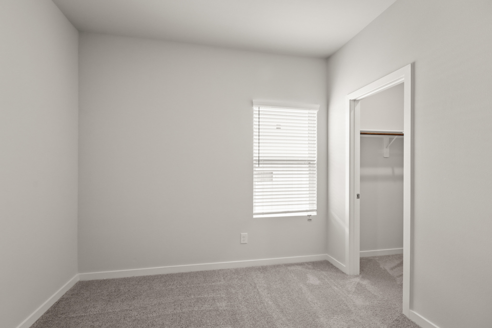 A room with a door and a window.