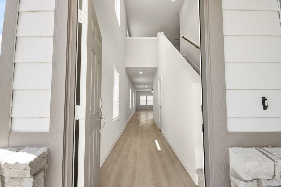 A hallway with white walls.