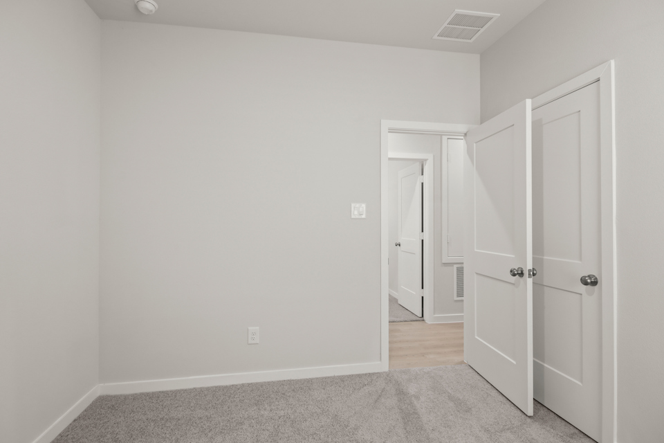 A room with white doors.