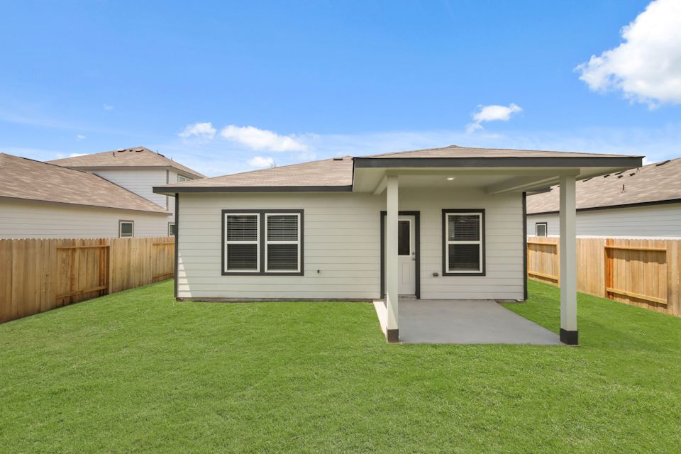 A house with a fence around it.