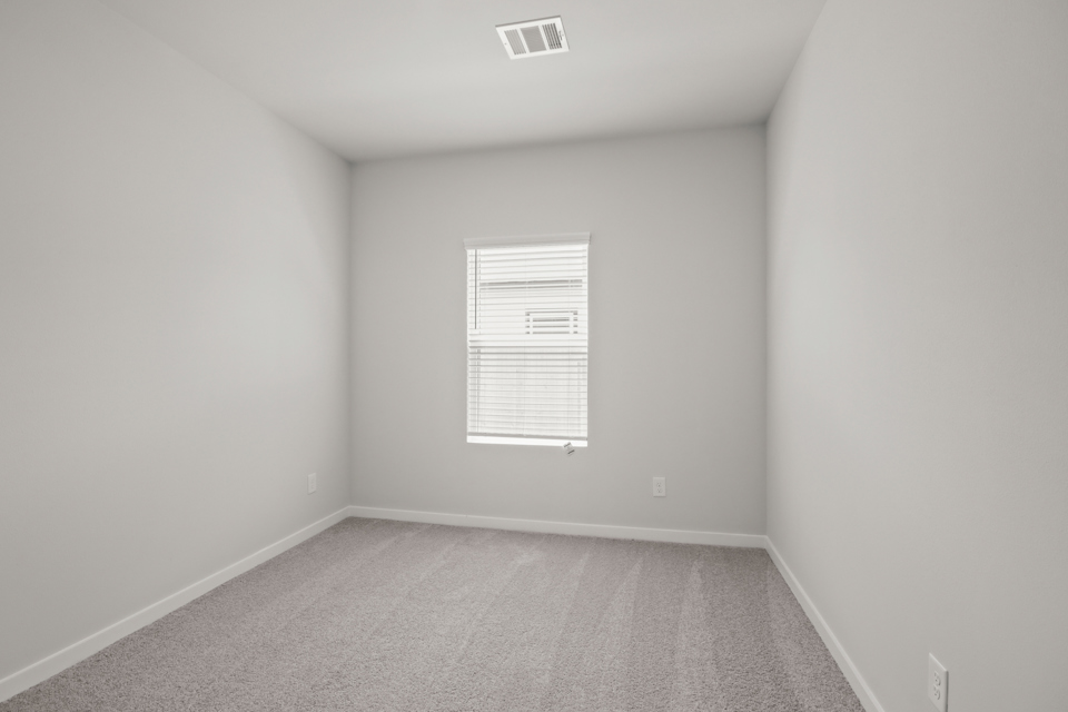 A room with a door and a window.