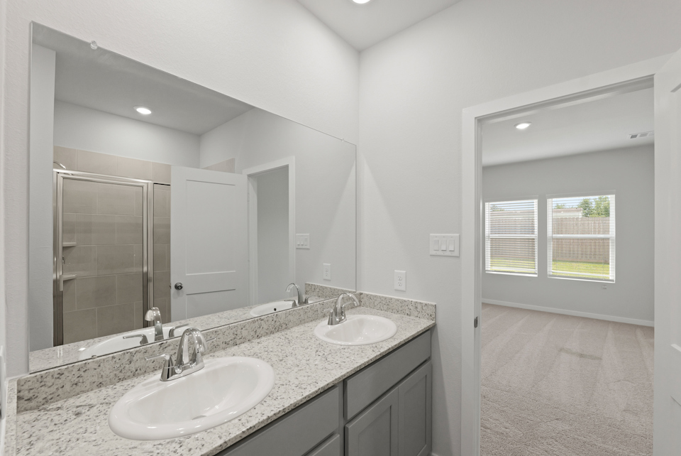 A bathroom with two sinks.