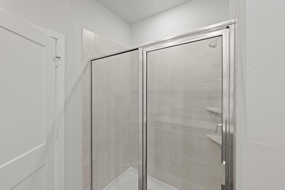 A shower unit in a bathroom.