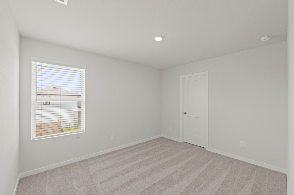 A room with a door and a window.