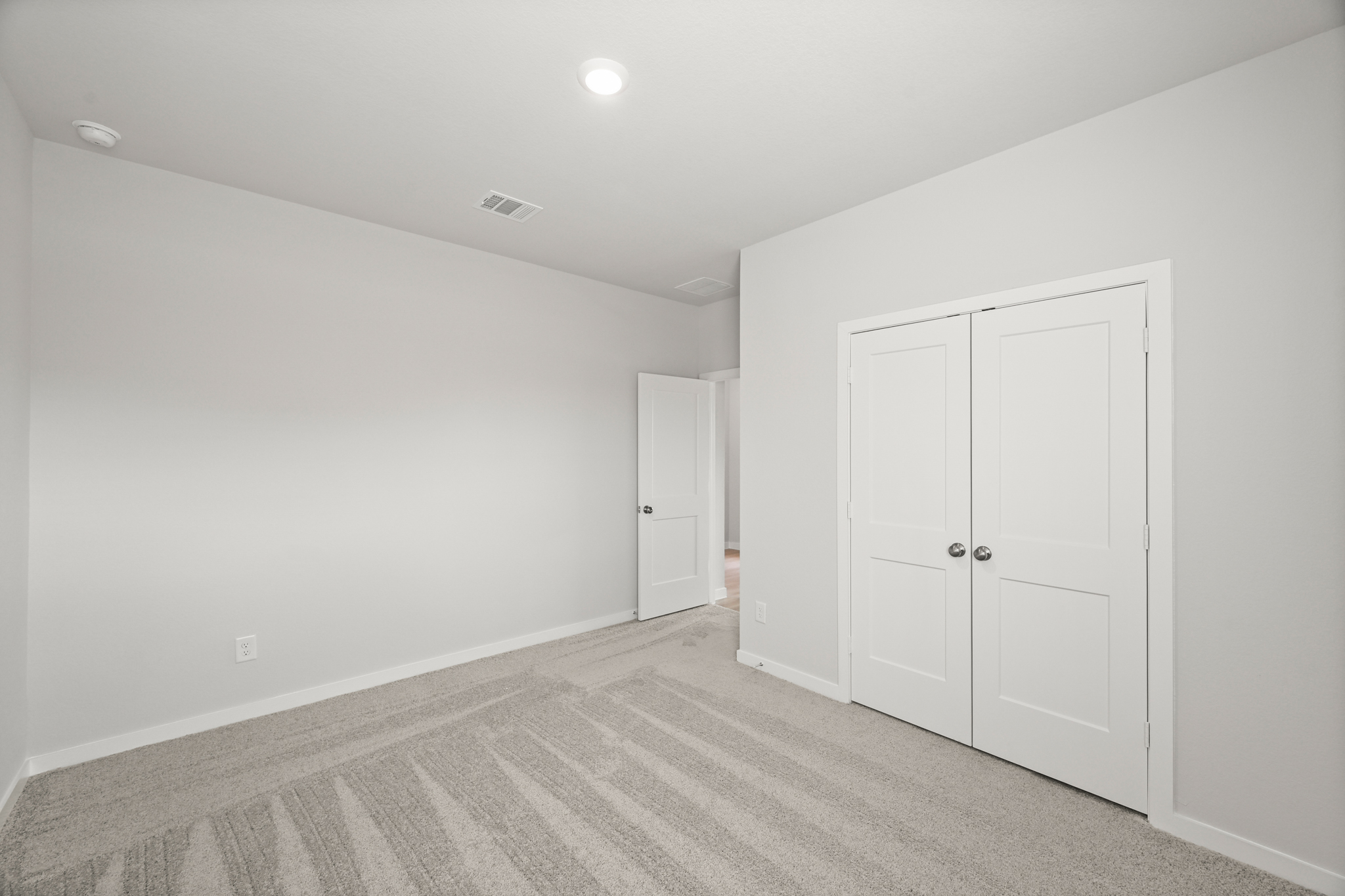 A room with white doors.