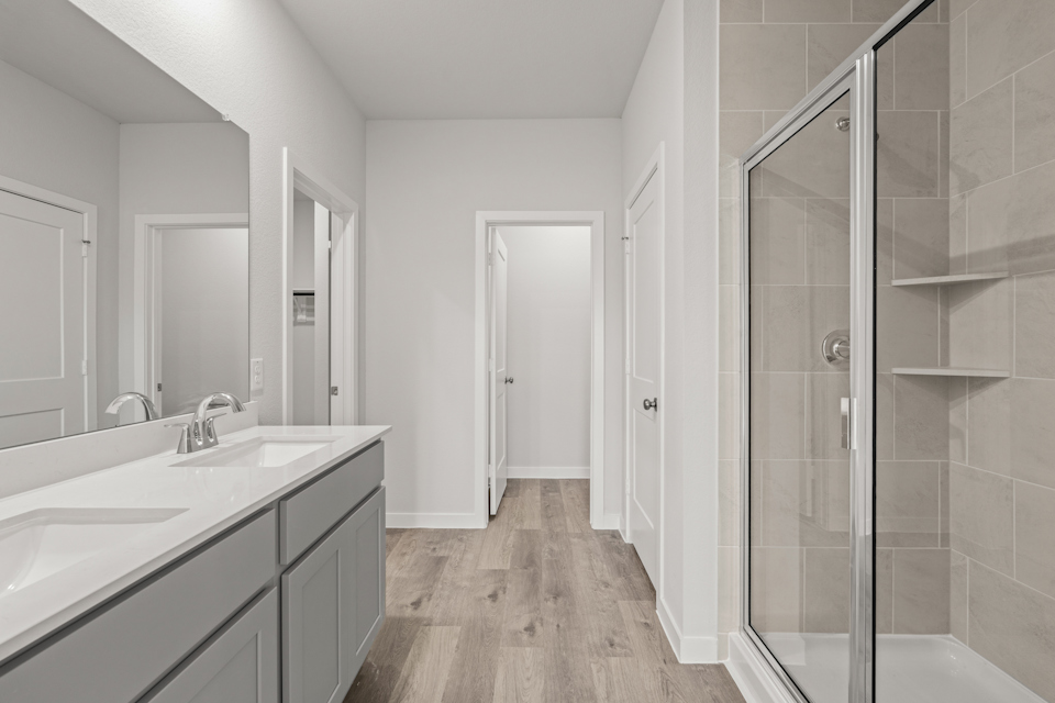 A bathroom with a glass shower.