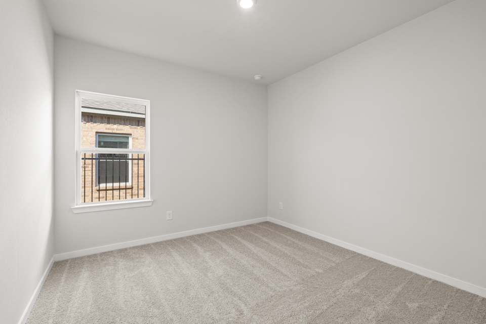 A room with a window and a door.