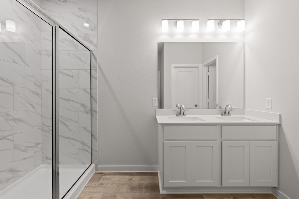 A bathroom with a glass shower.