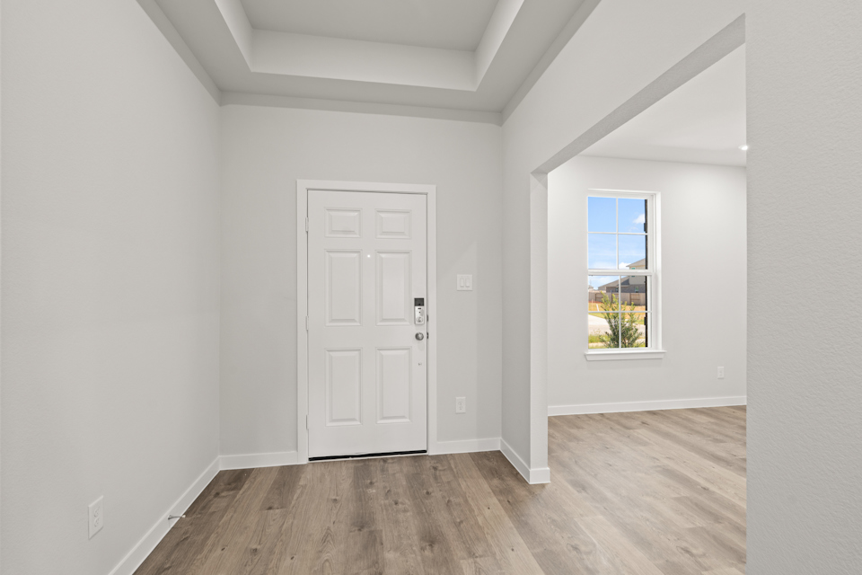 A room with a door and a window.