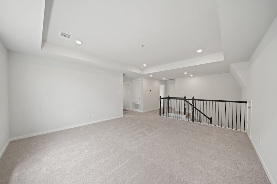 A long hallway with white walls.