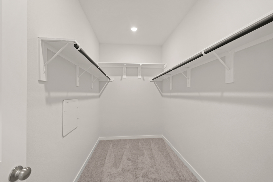 A white room with a staircase.
