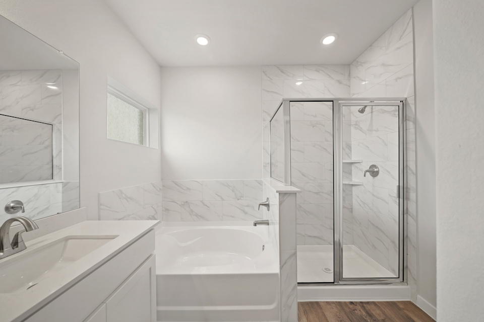A bathroom with a glass shower.