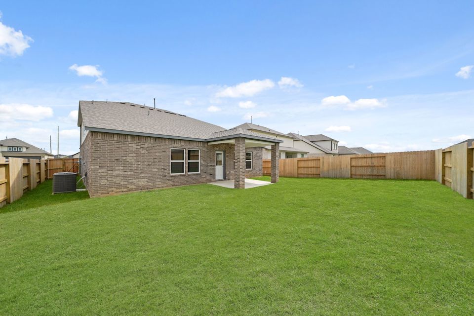 A house with a fence around it.
