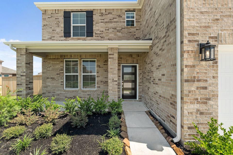 A brick building with a walkway.