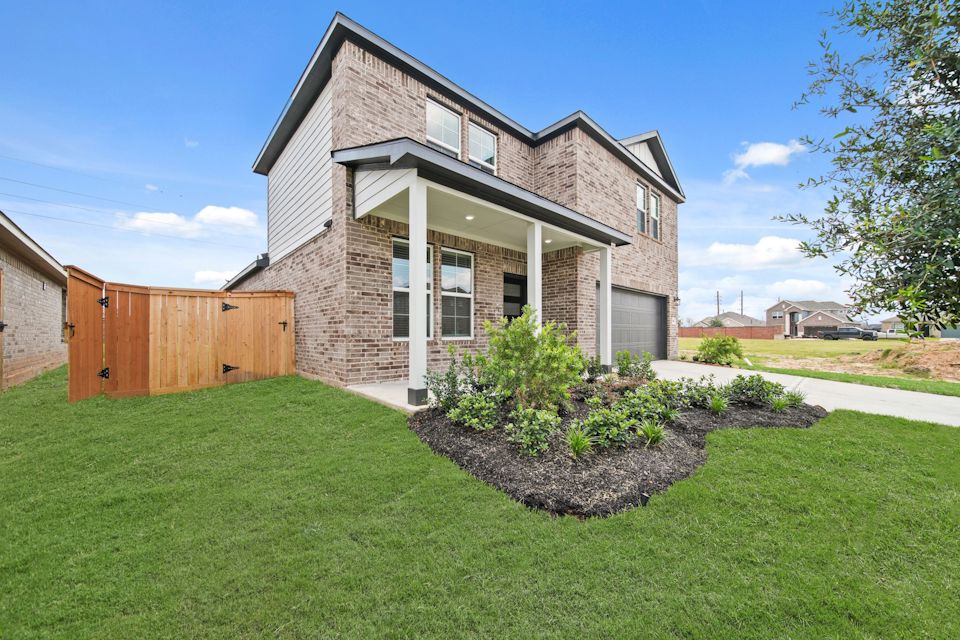 A house with a large front yard.