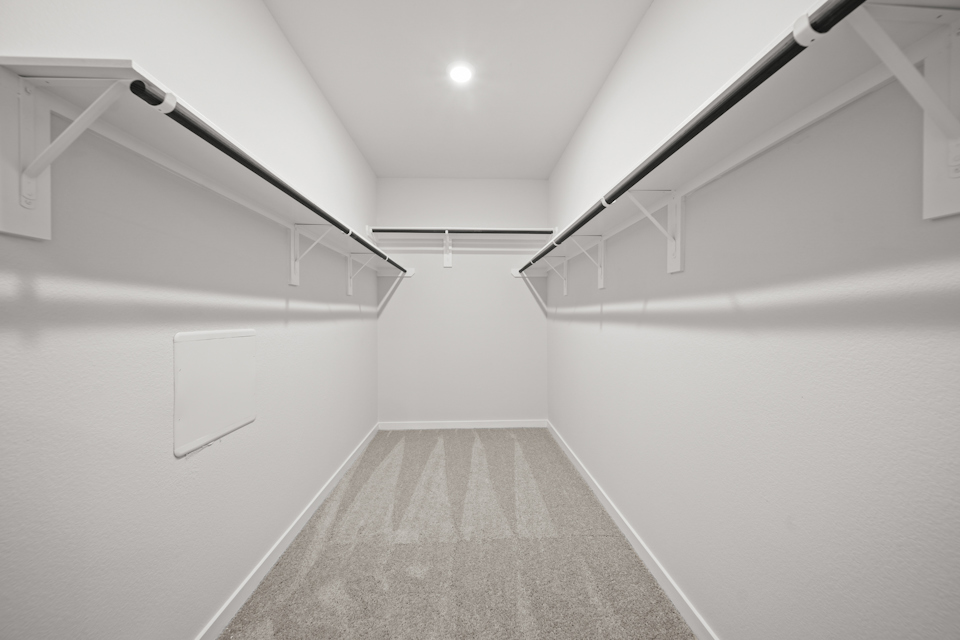 A hallway with white walls.