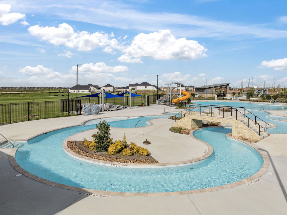 A pool with a small island in it.