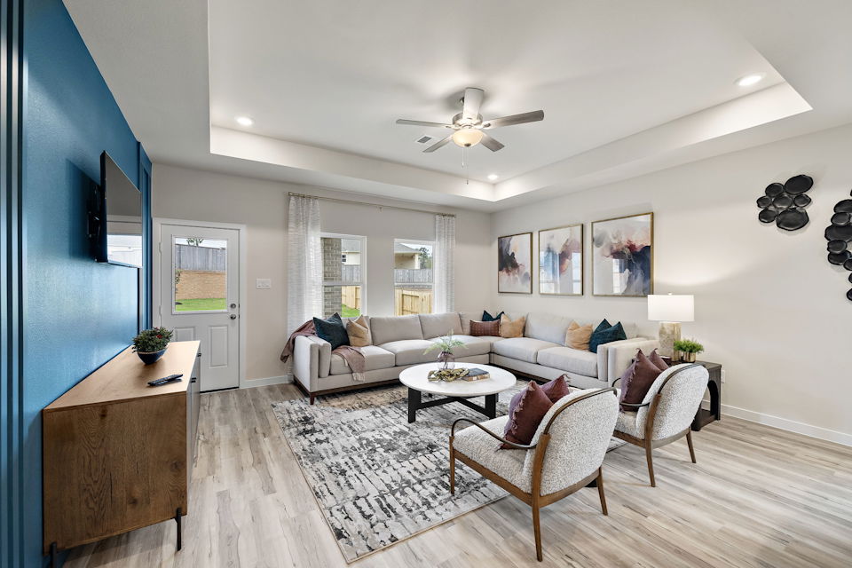 A living room with a couch and a table.