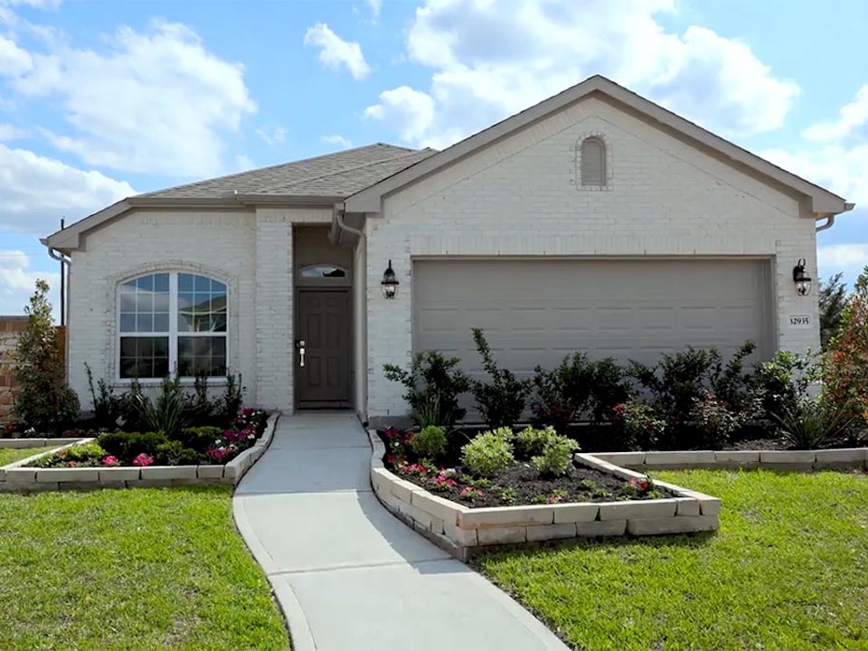 A house with a large front yard.