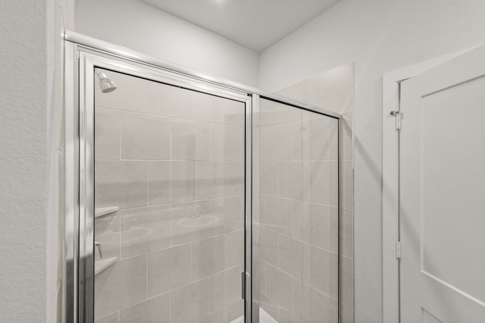 A shower unit in a bathroom.