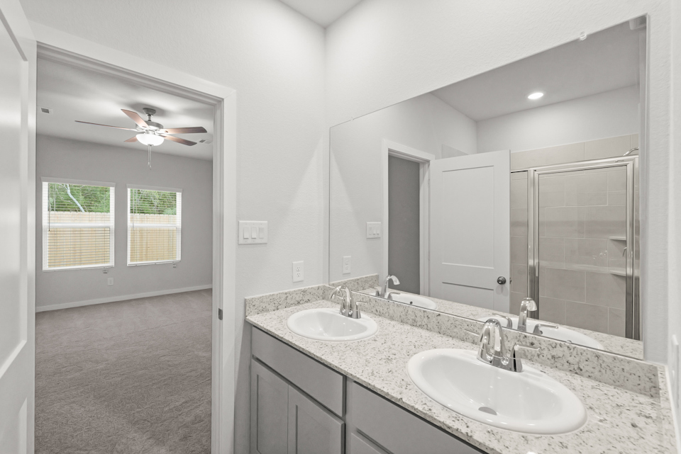 A bathroom with two sinks.