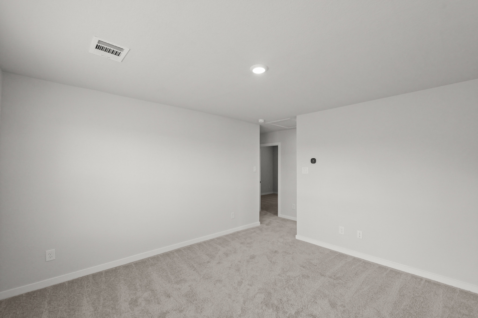 A hallway with a door.