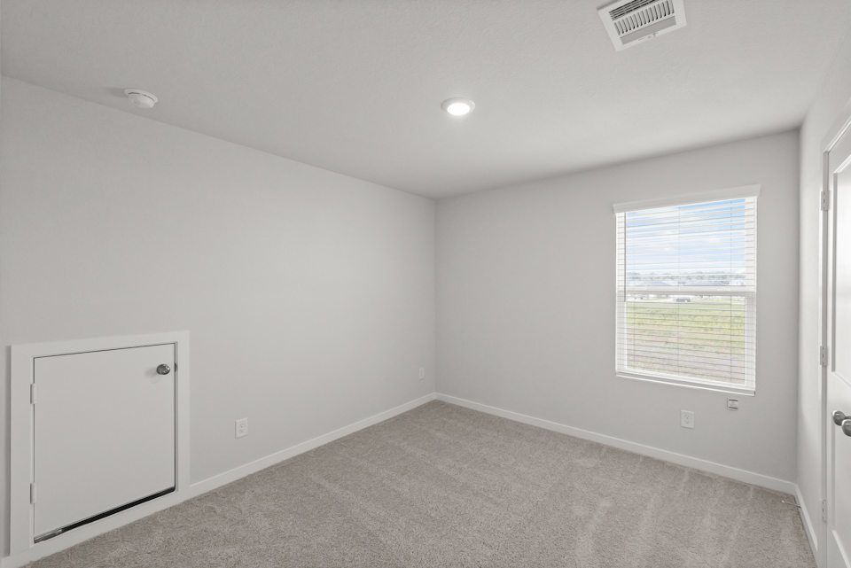 A room with a door and a window.