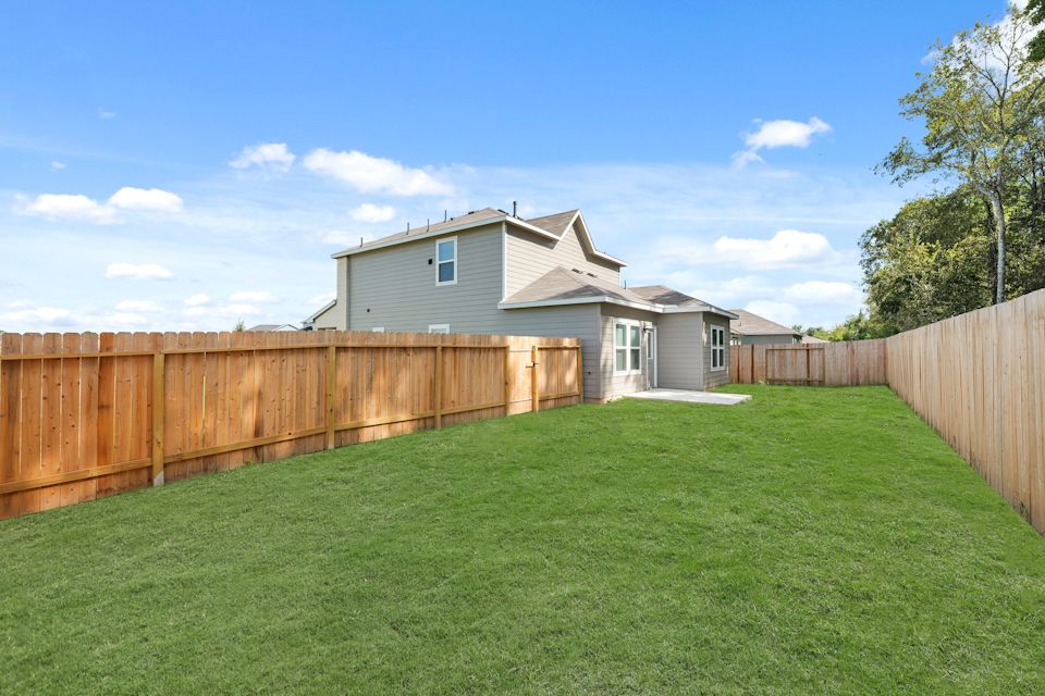 A house with a fence around it.