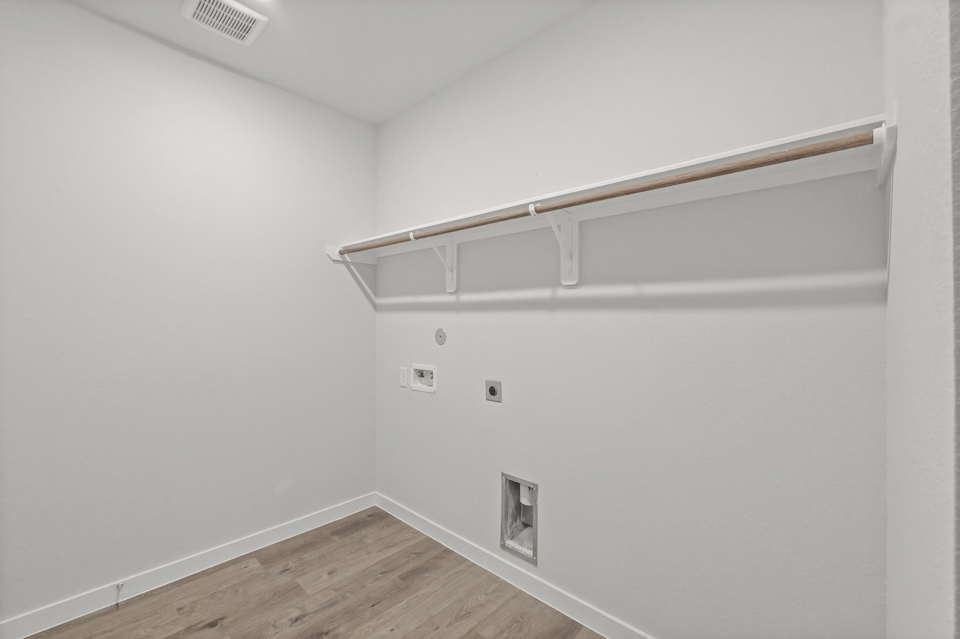 A white wall with a white ceiling.