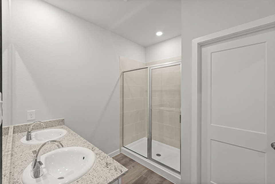 A bathroom with a glass shower.