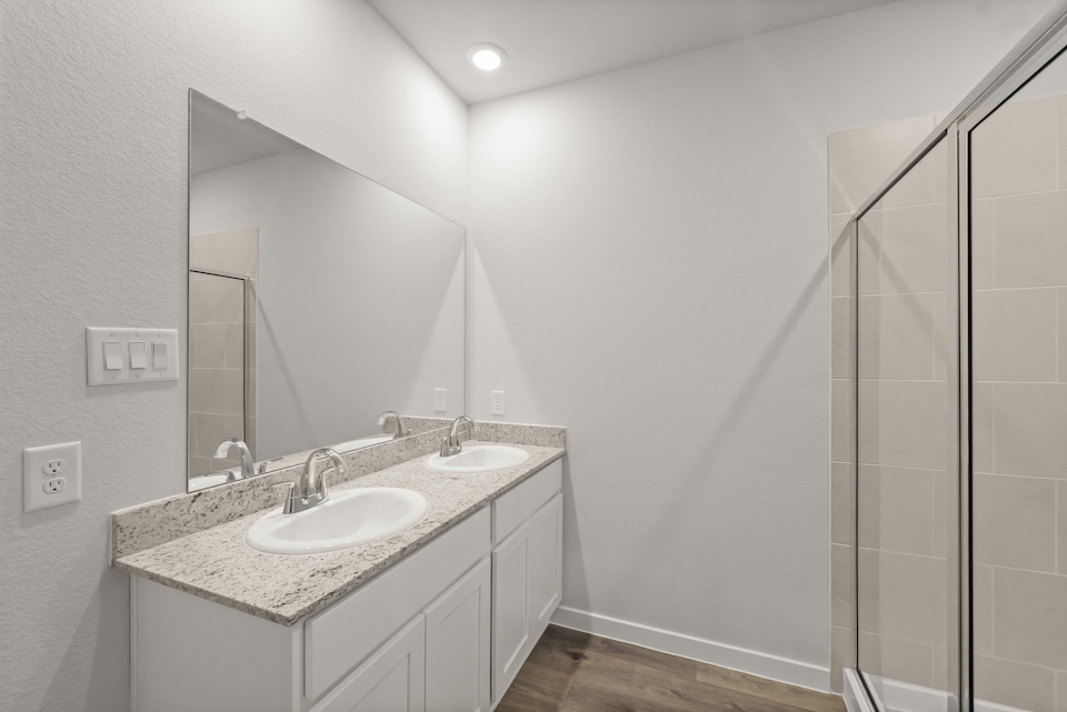 A bathroom with a glass shower.