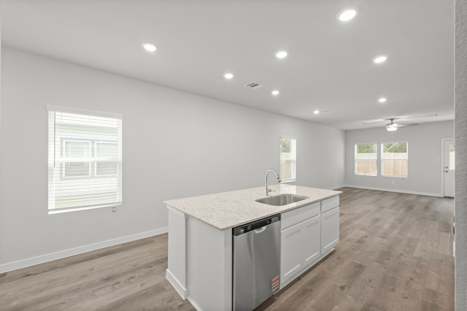 A kitchen with a sink and cabinets.