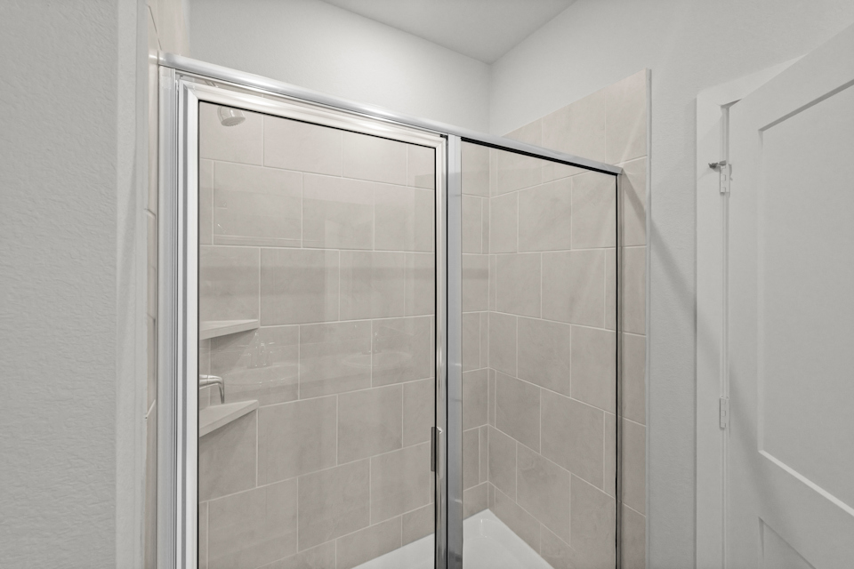 A shower unit in a bathroom.