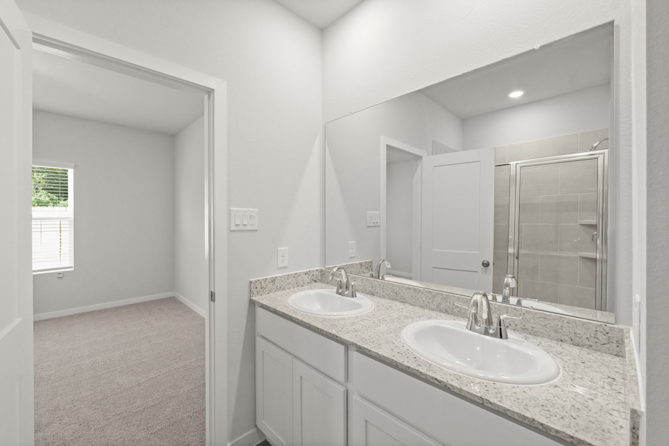 A bathroom with two sinks.
