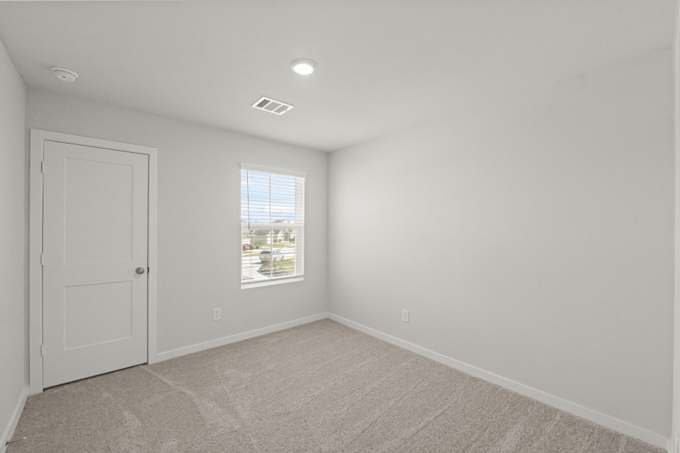 A room with a door and a window.