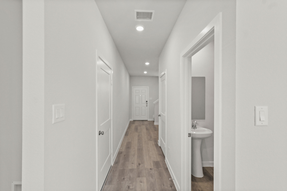 A bathroom with a sink and a mirror.