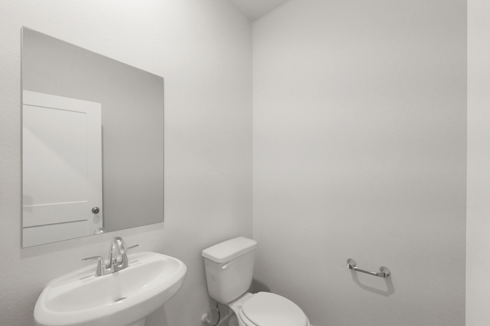 A bathroom with a sink and toilet.