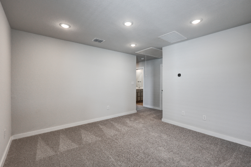 A hallway with white walls.