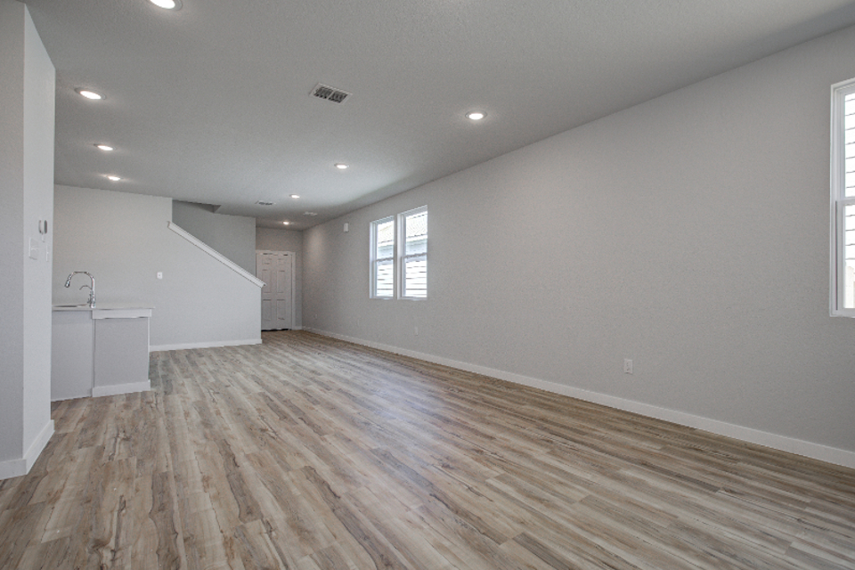 A room with a wood floor and a wood floor.