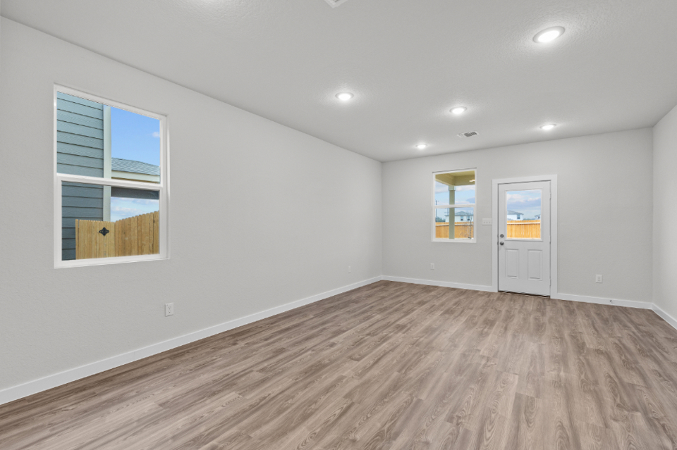 A room with white walls and windows.