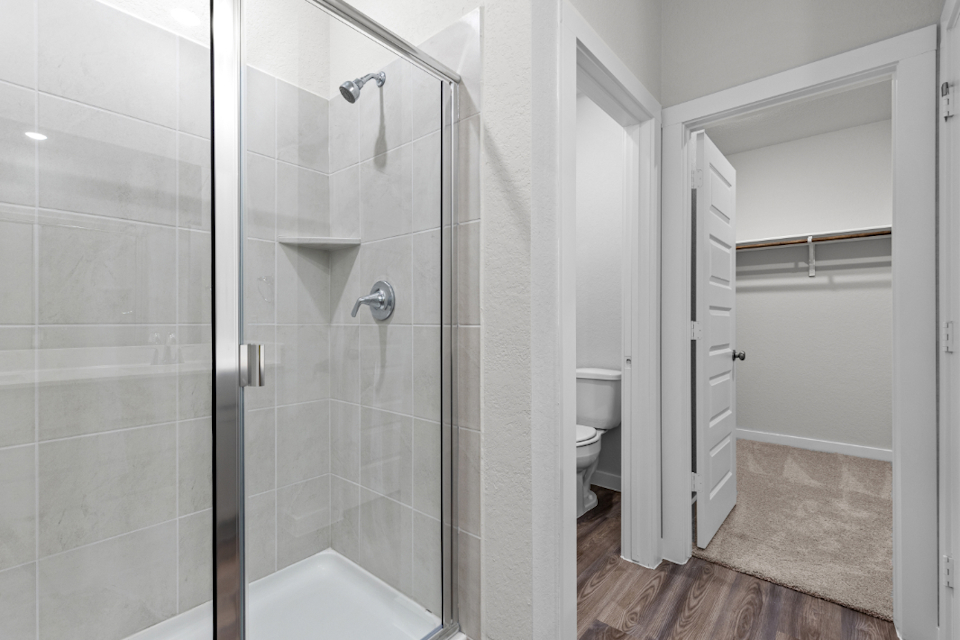A bathroom with a glass shower.