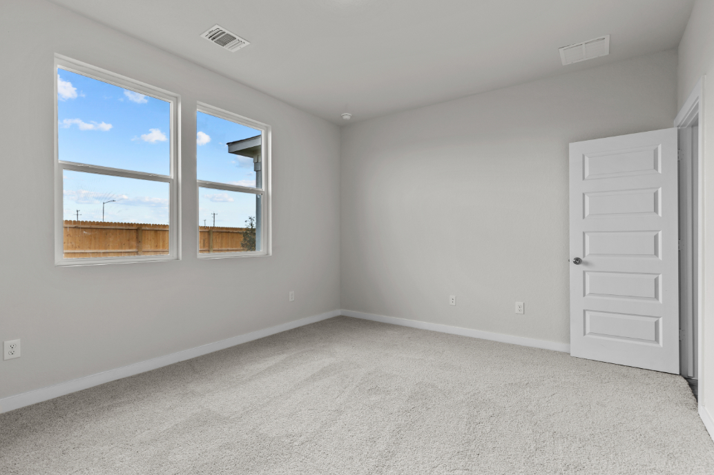 A room with a window and a door.