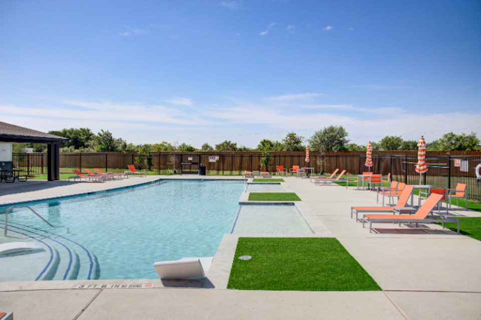 A swimming pool with a fence around it.