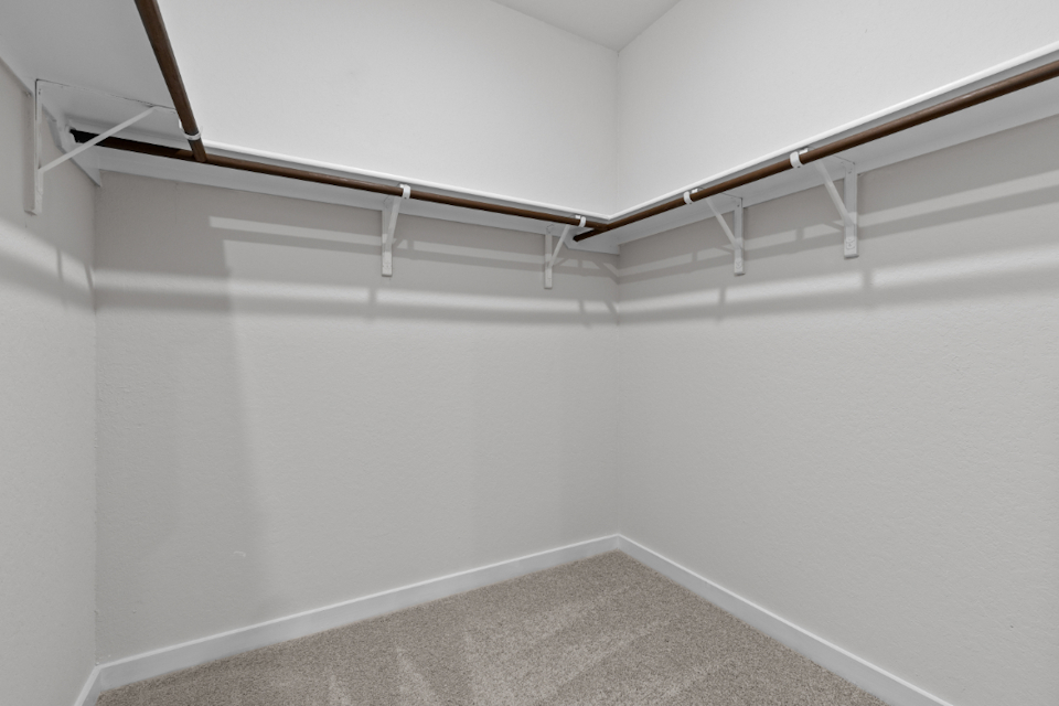 A white wall with a white floor.