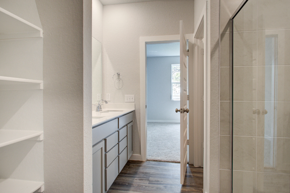 A bathroom with a glass shower.