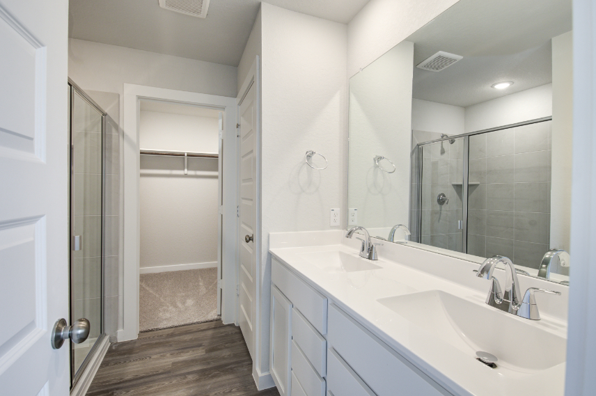 A bathroom with a glass shower.
