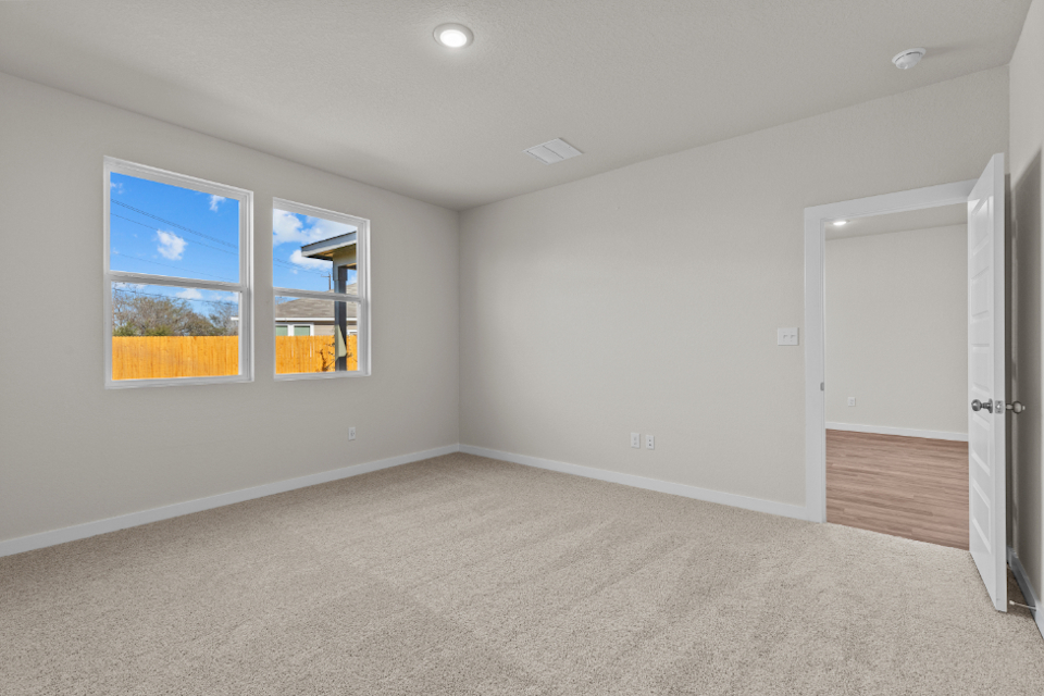 A room with a window and a door.