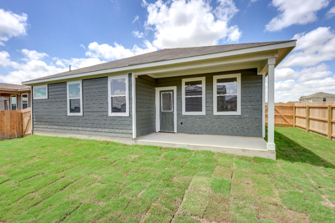 A house with a fence around it.